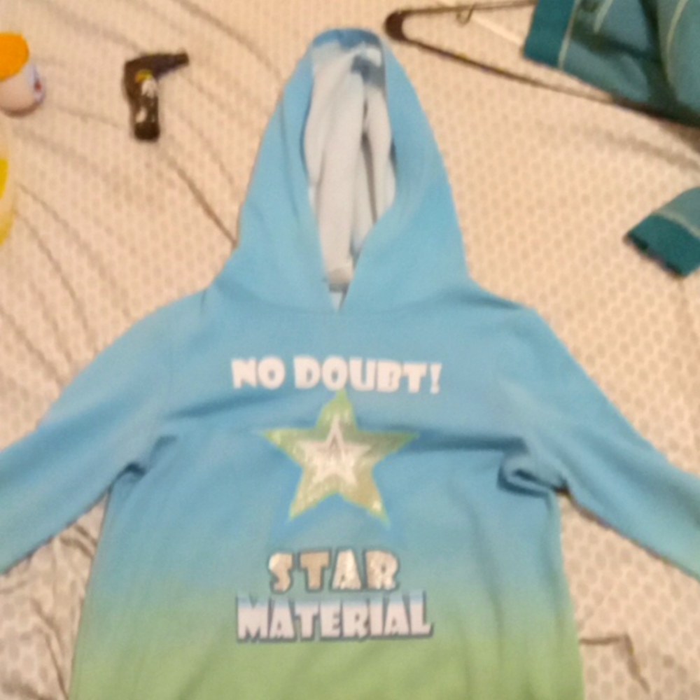 Blue hoodie with writing .